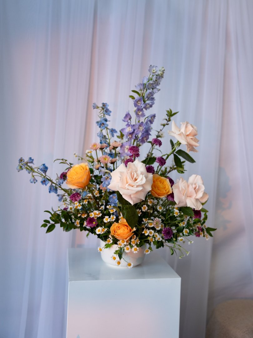 Floral arrangement by Blooms by Sara